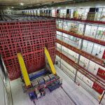 a massive (5-story!) cubic array shows red detectors in an industrial setting